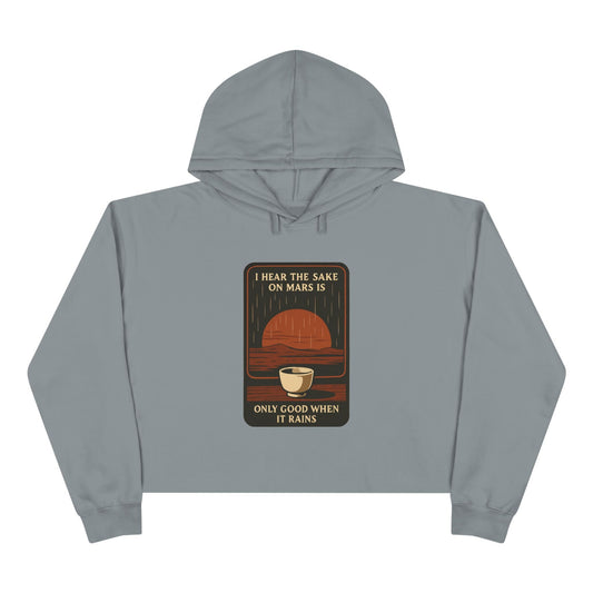 Mars Sake Crop Hoodie featuring a retro graphic of a Martian horizon and a steaming cup.